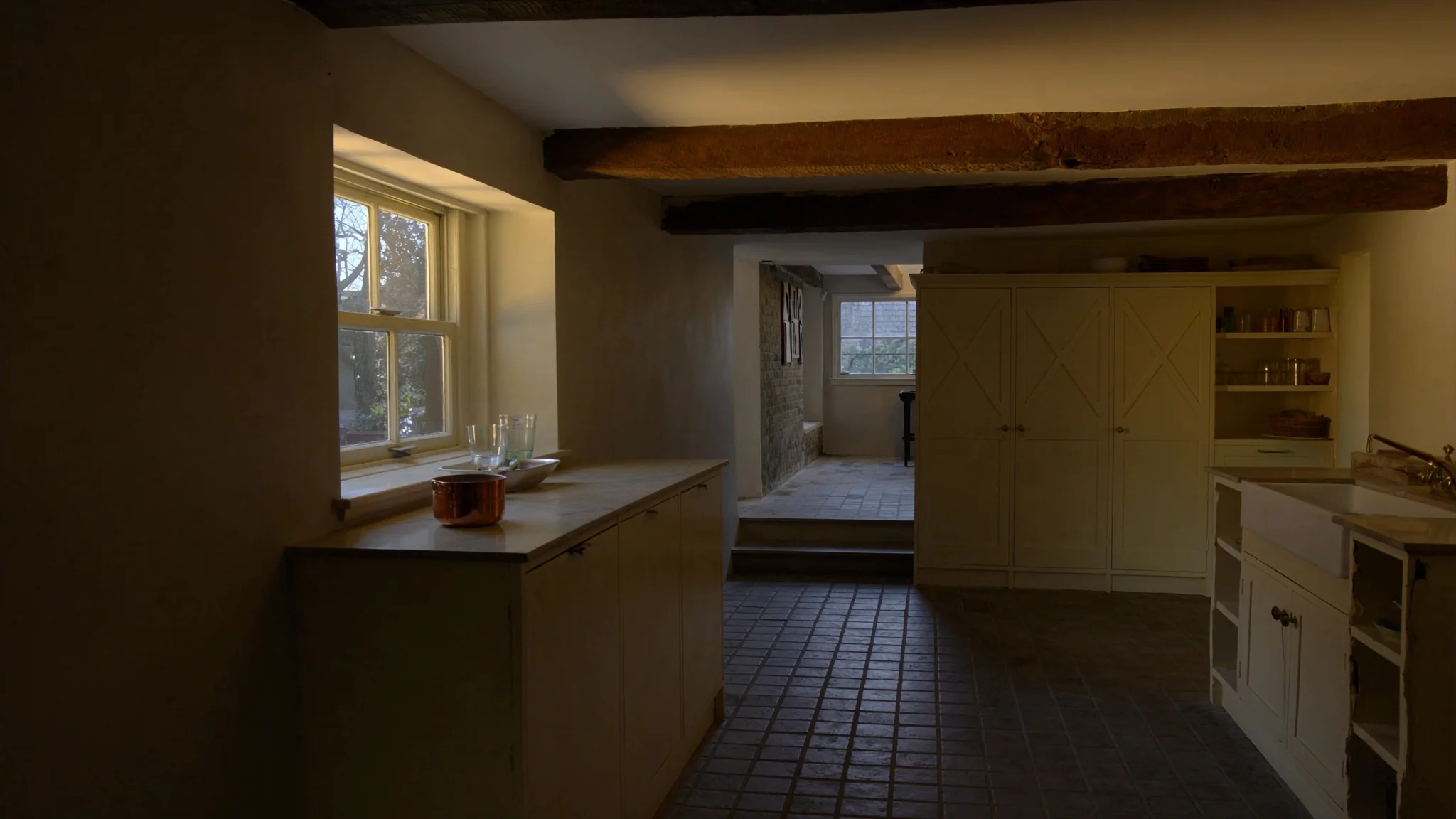 Illustrative warm ivory kitchen in an intimate listed London mews house