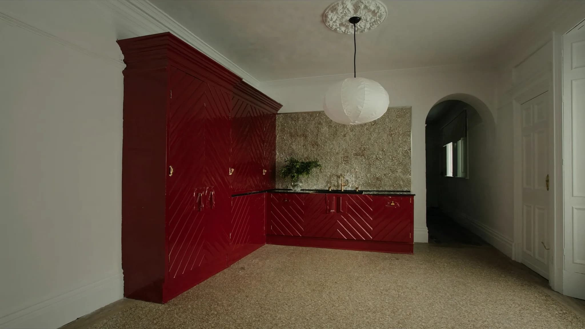 Illustrative oxblood kitchen joinery in a Kensington Victorian home